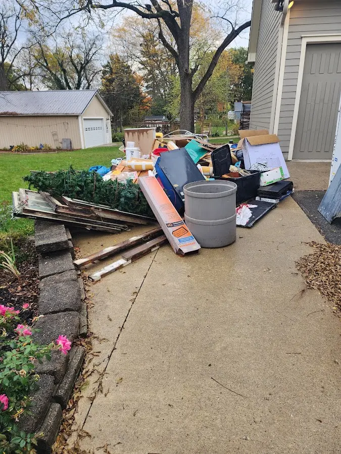 Dumpster being loaded with debris for Roofing Dumpster Rental in Chicago